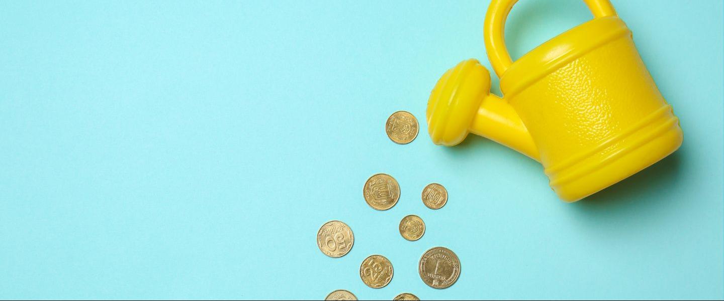 watering can pouring coins